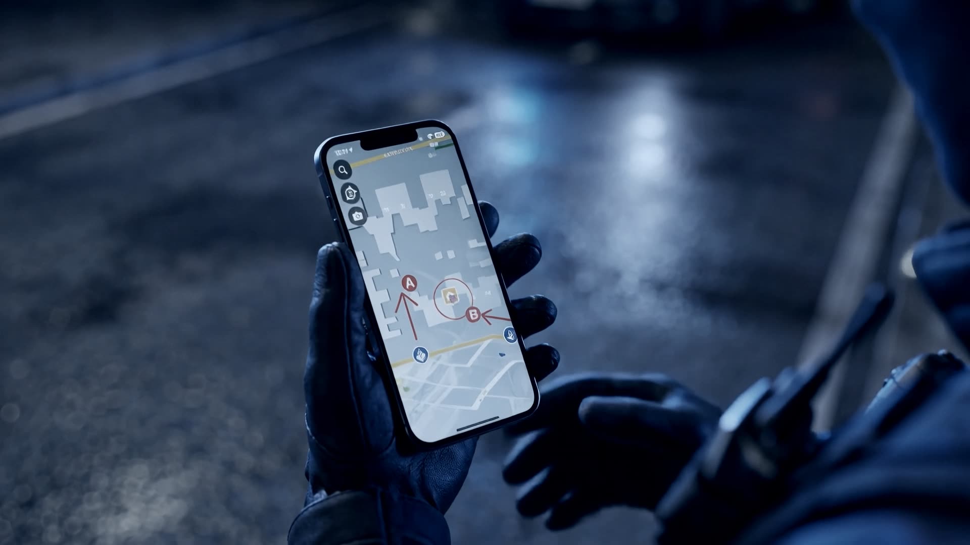 A firefighter in gloves at night holding an iPhone with LIVEOP Response: the attack plan with entry routes A and B to the incident