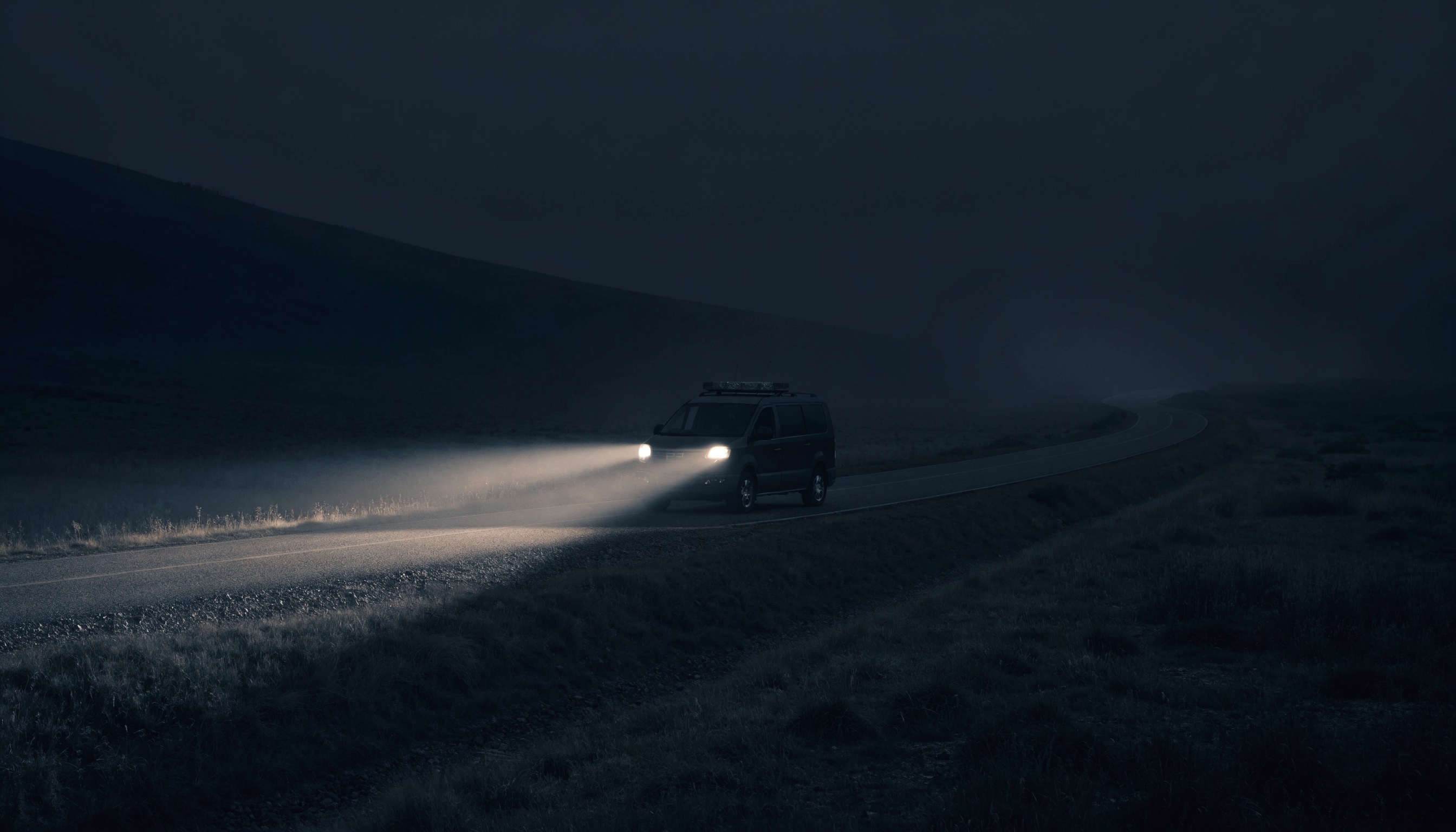 Emergency vehicle on a remote road at night